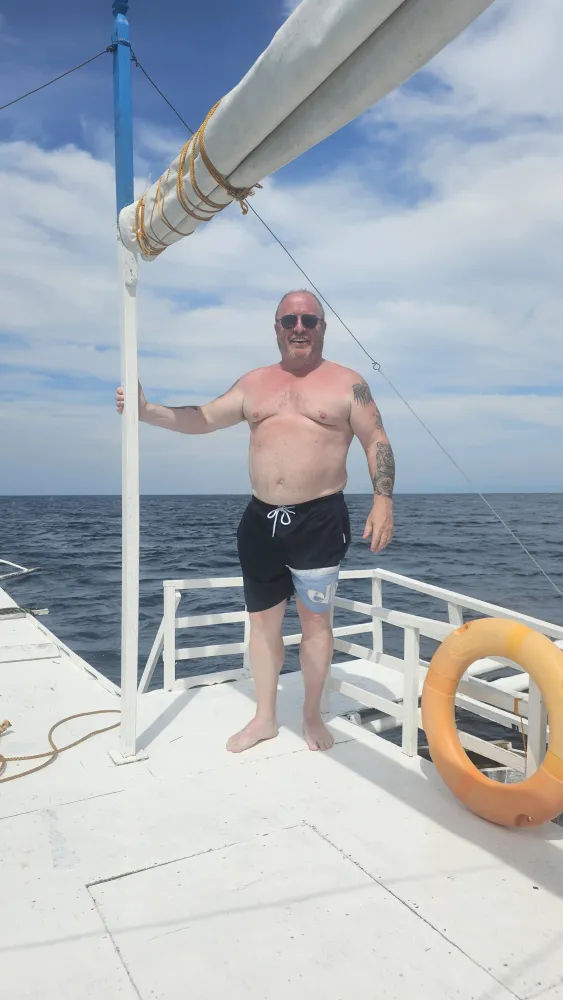 Tony on a boat at around 92kg